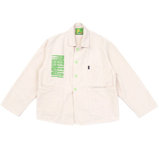 Off-white jacket with green Free & Easy graphic and buttons on a white background