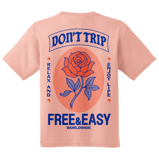 Pink t-shirt with a rose graphic and 'Don't trip Free & easy' text on the back