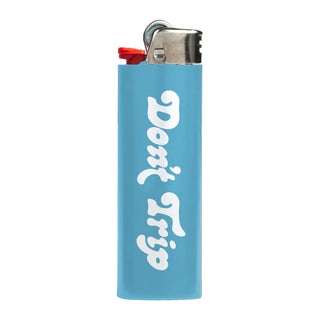 Don't Trip light blue lighter with white font, back, on white background - Free & Easy