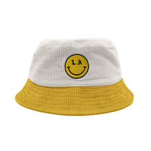 Load image into Gallery viewer, LA Be Happy smiley face embroidered on white corduroy yellow brim bucket hat on white background, front - Free &amp; Easy
