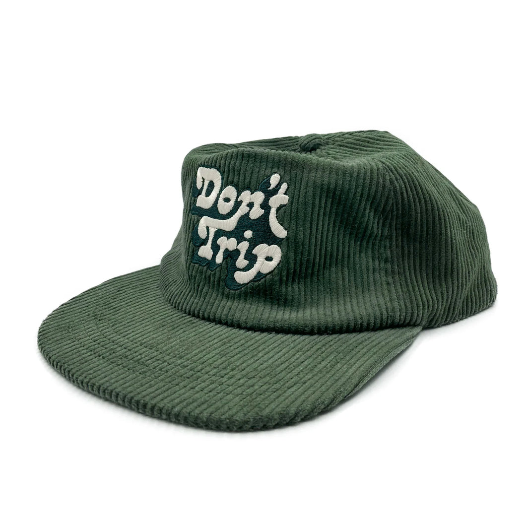 Don't Trip green corduroy hat with white and green embroidered Don't Trip logo on a white background - Free & Easy