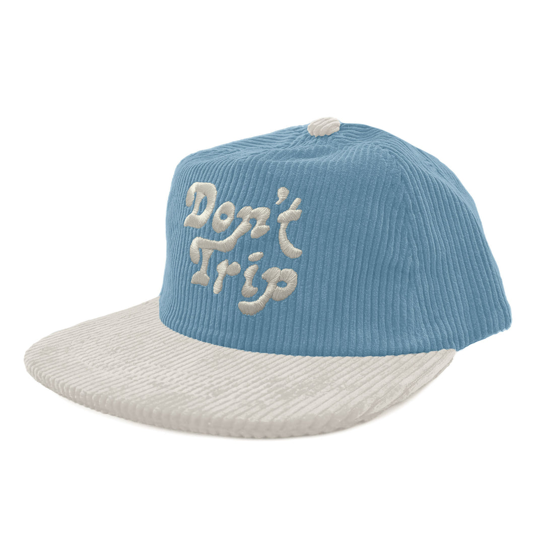 Don't Trip blue and white corduroy hat with white embroidered Don't Trip logo on a white background, front - Free & Easy
