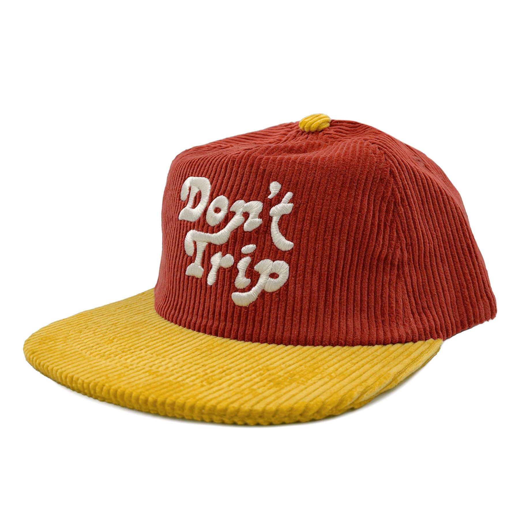 Don't Trip red and yellow corduroy hat with white embroidered Don't Trip logo on a white background, front - Free & Easy