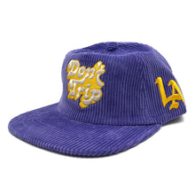 Load image into Gallery viewer, Don&#39;t Trip purple corduroy hat with white and yellow embroidered Don&#39;t Trip logo and yellow LA logo on a white background, front - Free &amp; Easy
