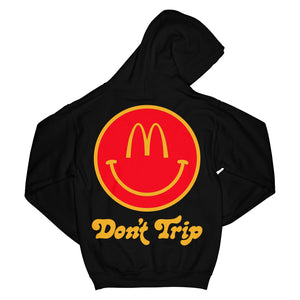 Camp McDonalds Be Happy OG Hoodie in black with yellow and red McDonald's smiley face Don't Trip logo on back on white background - Free & Easy