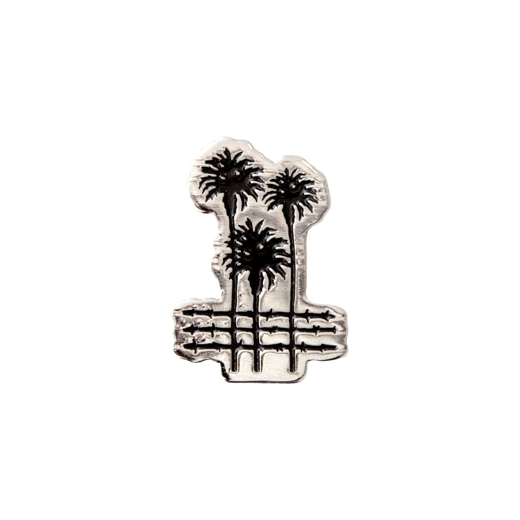 City Palms Enamel Pin in black and silver on a white background -Free & Easy