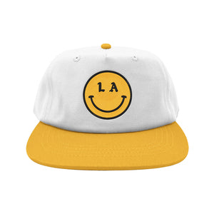 Be Happy LA white hat yellow brim with yellow and black smiley face embroidery on white background, front - Free & Easy