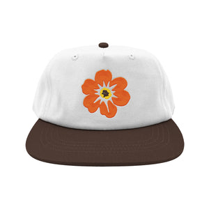 Free & Easy white and brown hat with orange and yellow flower on a white background - Free & Easy