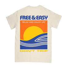 Load image into Gallery viewer, Shores SS Tee in natural with blue, orange, and yellow shores design -Free &amp; Easy
