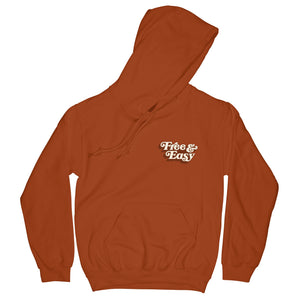 Don't Trip OG Hoodie in rust with white and light brown Free & Easy logo design on front left side on a white background - Free & Easy