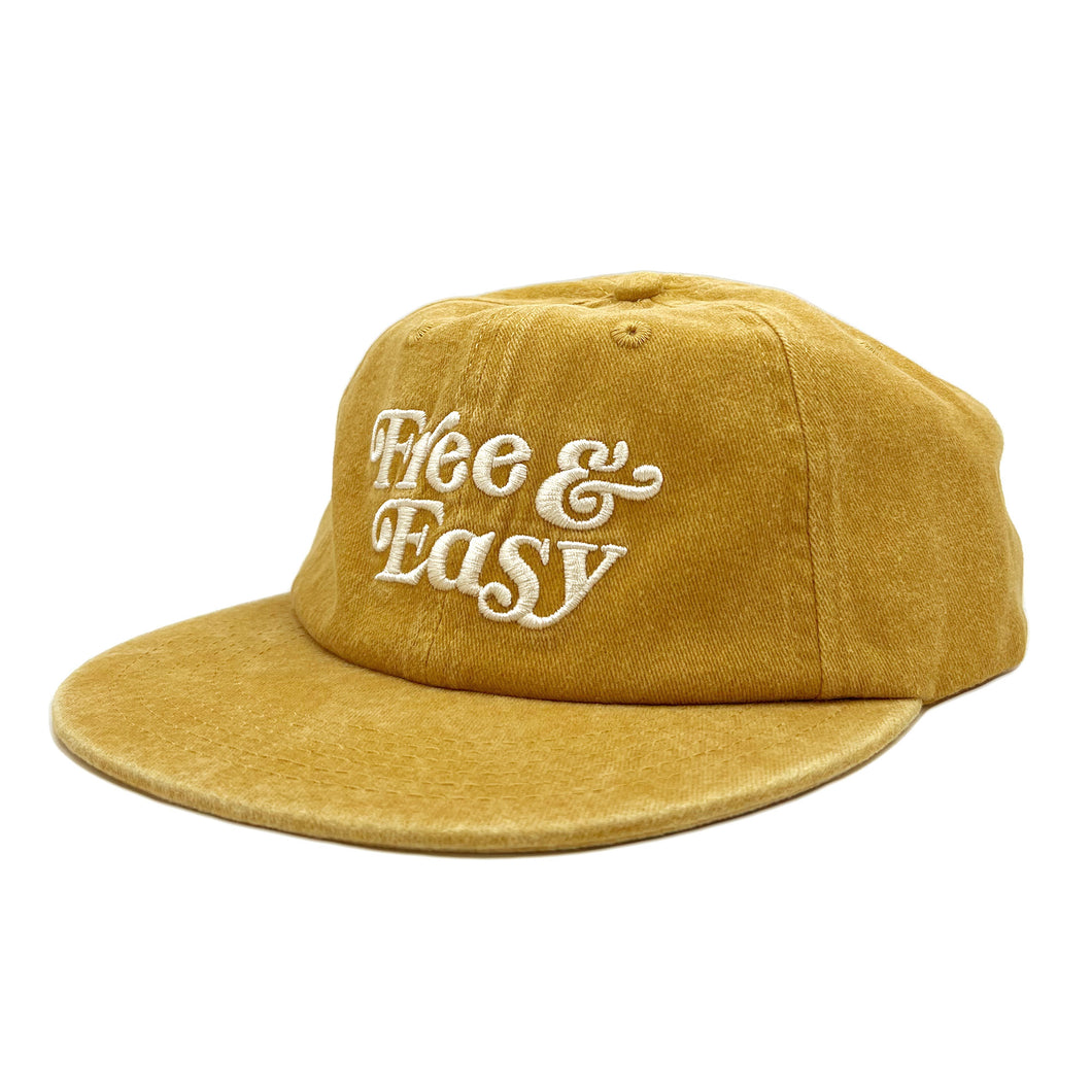 Free & Easy washed yellow hat with white embroidered Don't Trip logo on white background - Free & Easy