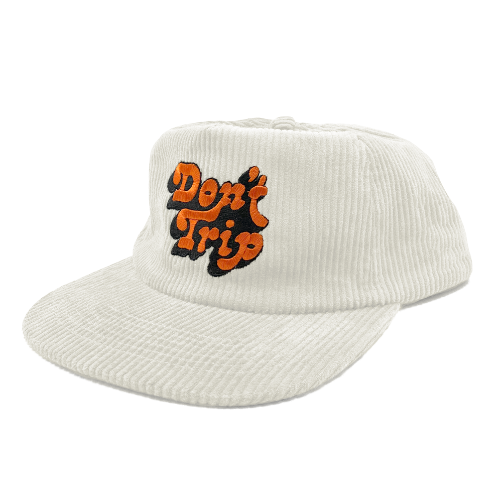 Don't Trip white corduroy hat with orange and black embroidered Don't Trip logo on a white background, front - Free & Easy