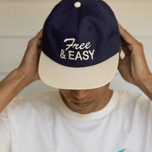 Load image into Gallery viewer, Free &amp; Easy navy hat white brim with white embroidered Free &amp; Easy logo on white background, model pictures - Free &amp; Easy
