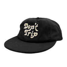 Load image into Gallery viewer, Don&#39;t Trip black hat with white embroidered Don&#39;t Trip logo on white background - Free &amp; Easy
