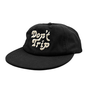 Don't Trip black hat with white embroidered Don't Trip logo on white background - Free & Easy