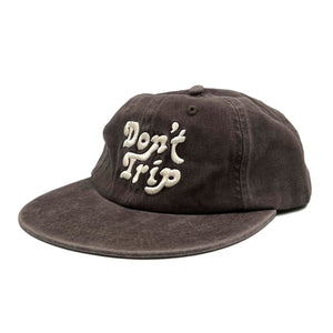 Don't Trip washed brown hat with white embroidered Don't Trip logo on white background - Free & Easy
