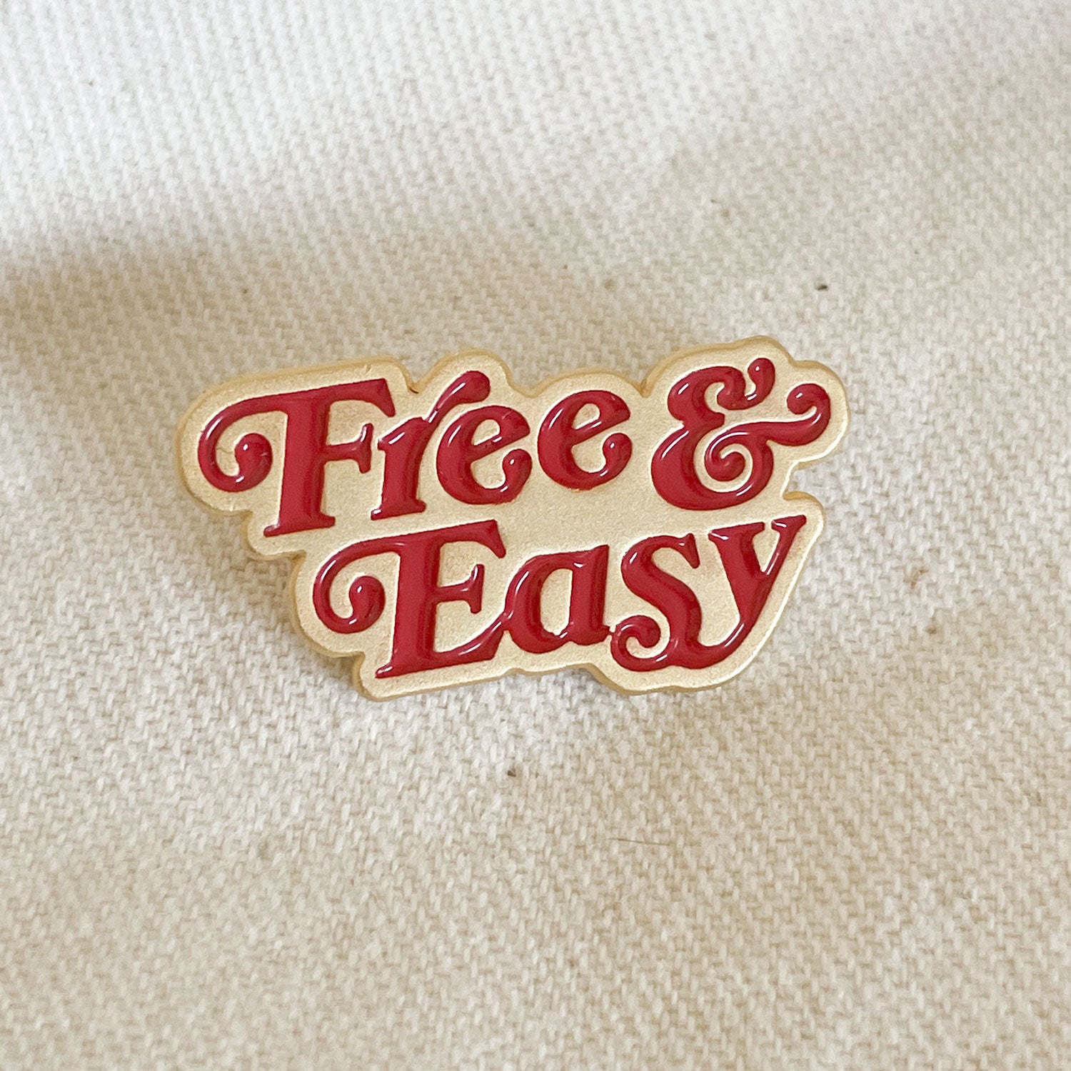 Free & Easy Enamel Pin in red and gold