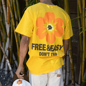Island Flower Short Sleeve Tee in yellow with an oraange flower and brown Free & Easy Don't Trip - Free & Easy