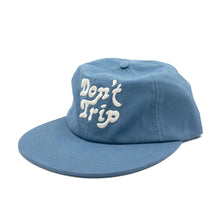 Load image into Gallery viewer, Don&#39;t Trip blue hat with white embroidered Don&#39;t Trip logo on white background - Free &amp; Easy
