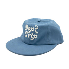 Load image into Gallery viewer, Don&#39;t Trip blue hat with white embroidered Don&#39;t Trip logo on white background - Free &amp; Easy
