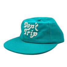 Load image into Gallery viewer, Don&#39;t Trip Lightweight Hat in teal with white Don&#39;t Trip embroidery on a white background - Free &amp; Easy
