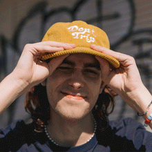 Load image into Gallery viewer, Don&#39;t Trip Fat Corduroy Hat in mustard with white Don&#39;t Trip embroidery on a white background -Free &amp; Easy
